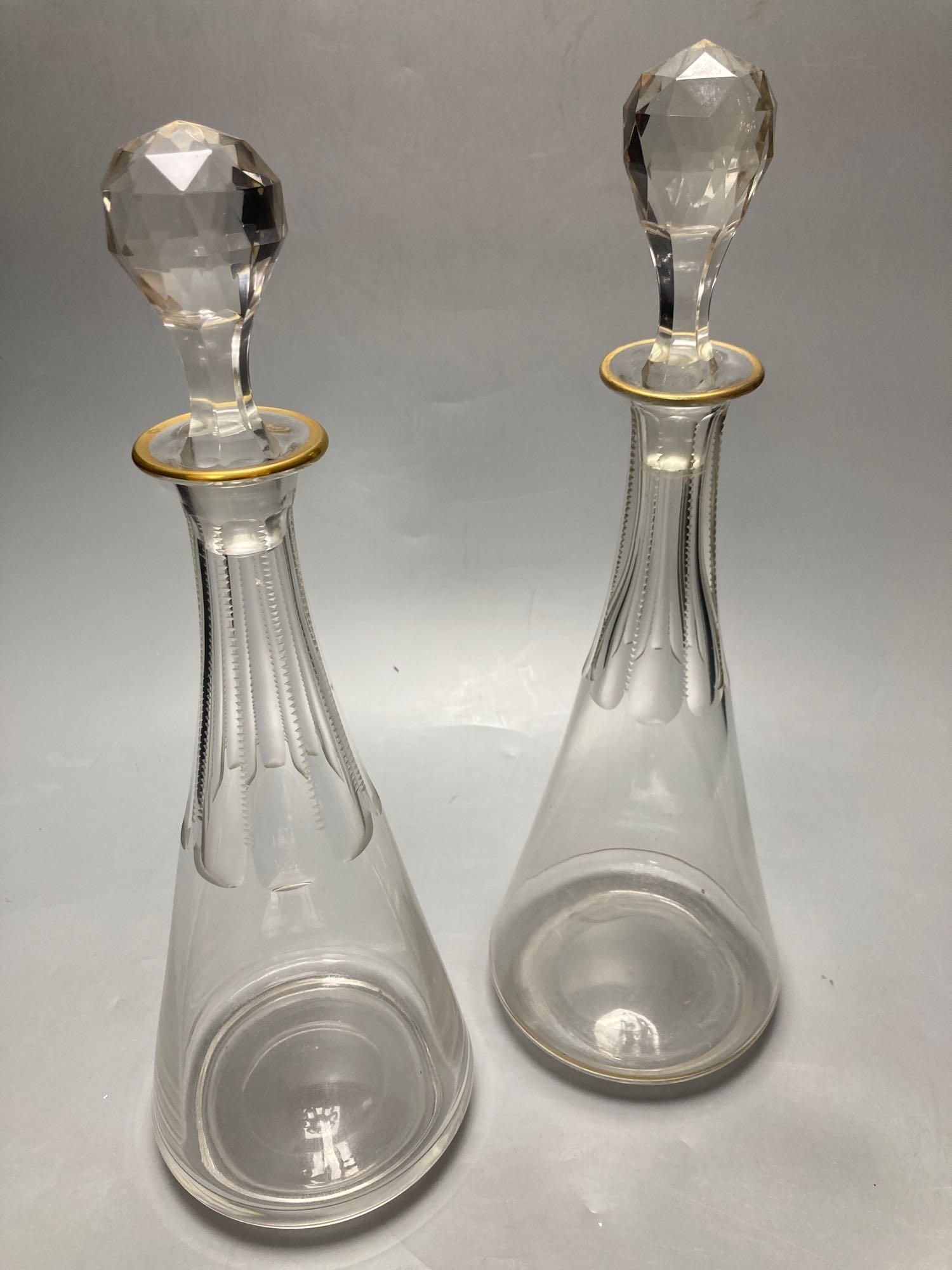 A pair of tall Bohemian cut glass decanters with faceted stoppers, unsigned, 35cm